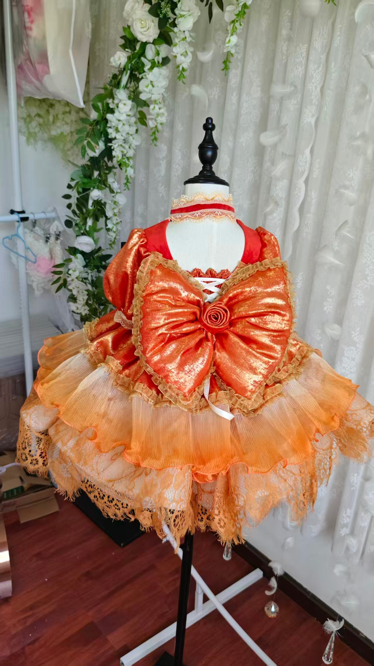 Dress on mannequin - back view with corset lacing and silk bow