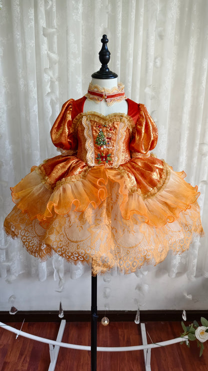 Dress on mannequin - front view showing embroidered panel and tiered skirt