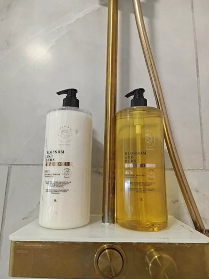 Blossom & Buds organic shampoo and conditioner 1L bottles in the shower