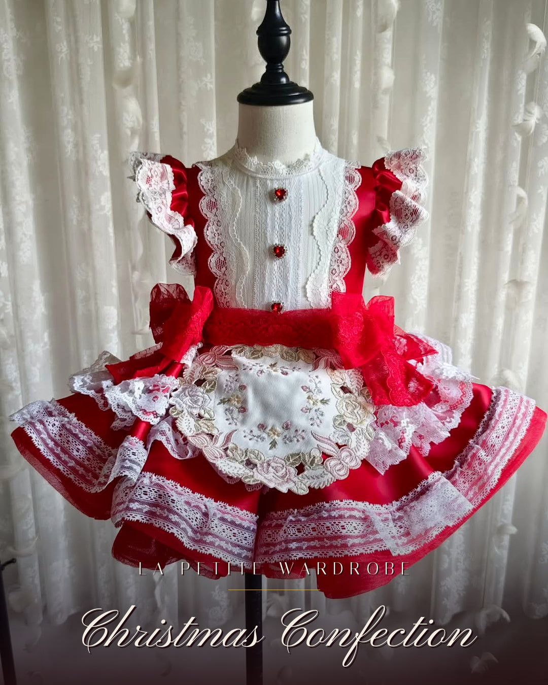 Front view of the Christmas Confection red taffeta Christmas dress with ivory lace trim and tulle sash