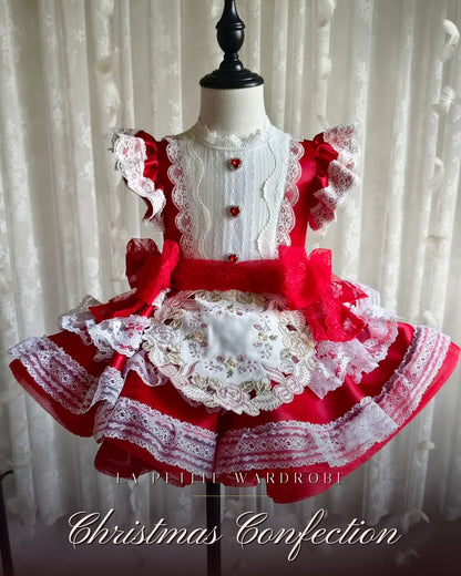 Front view of the Christmas Confection red taffeta Christmas dress with ivory lace trim and tulle sash