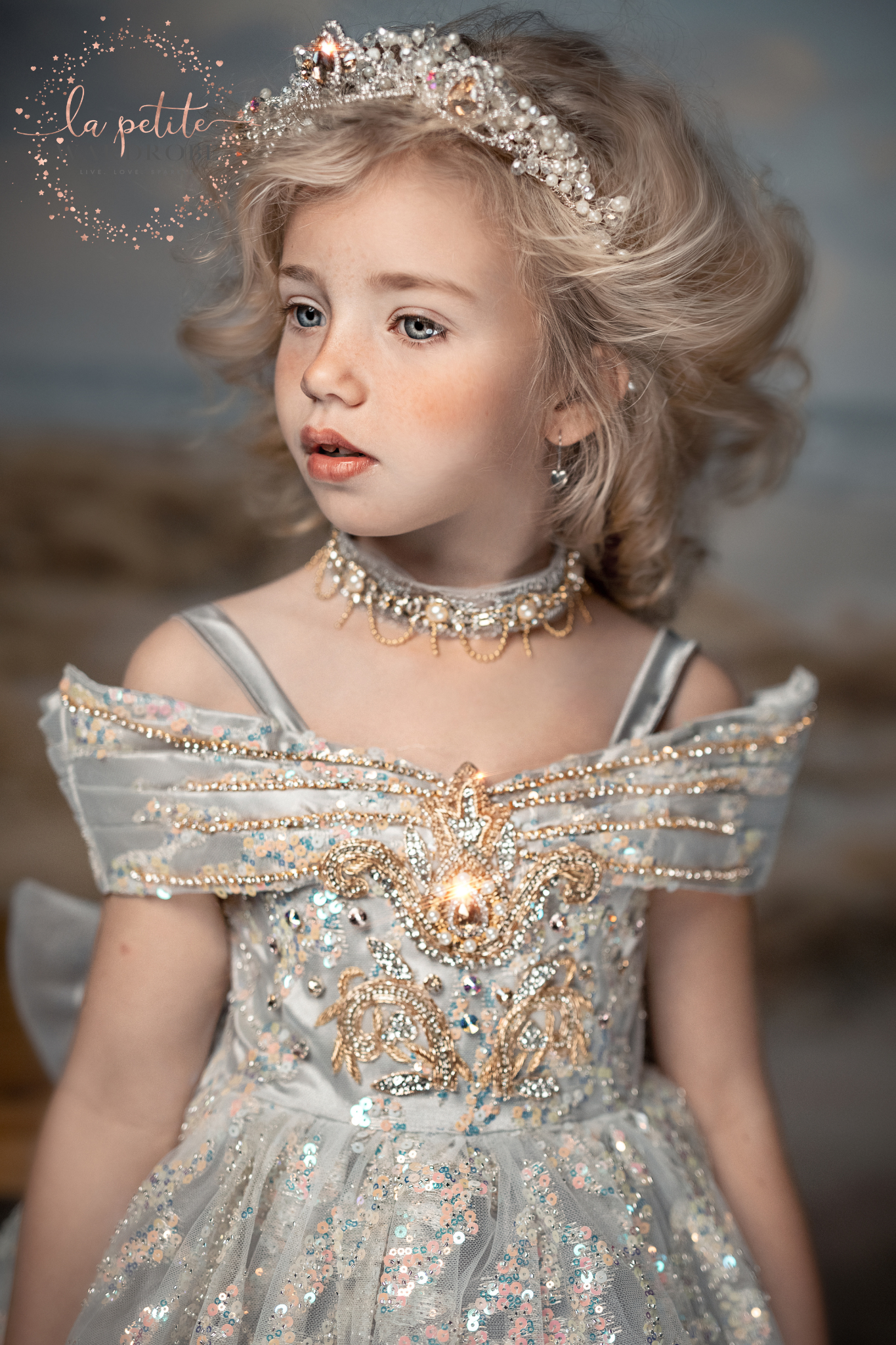 dress is made with sequin sparkly tulle and duchess satin with hand embroidered gold appliques decorated with colourful beads